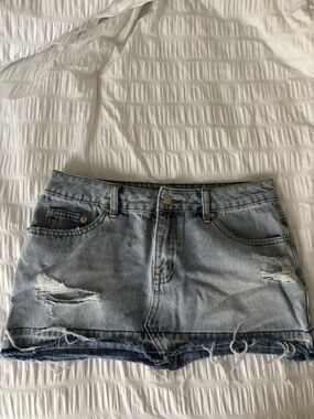 Edikted Light Wash Distressed Denim Skirt